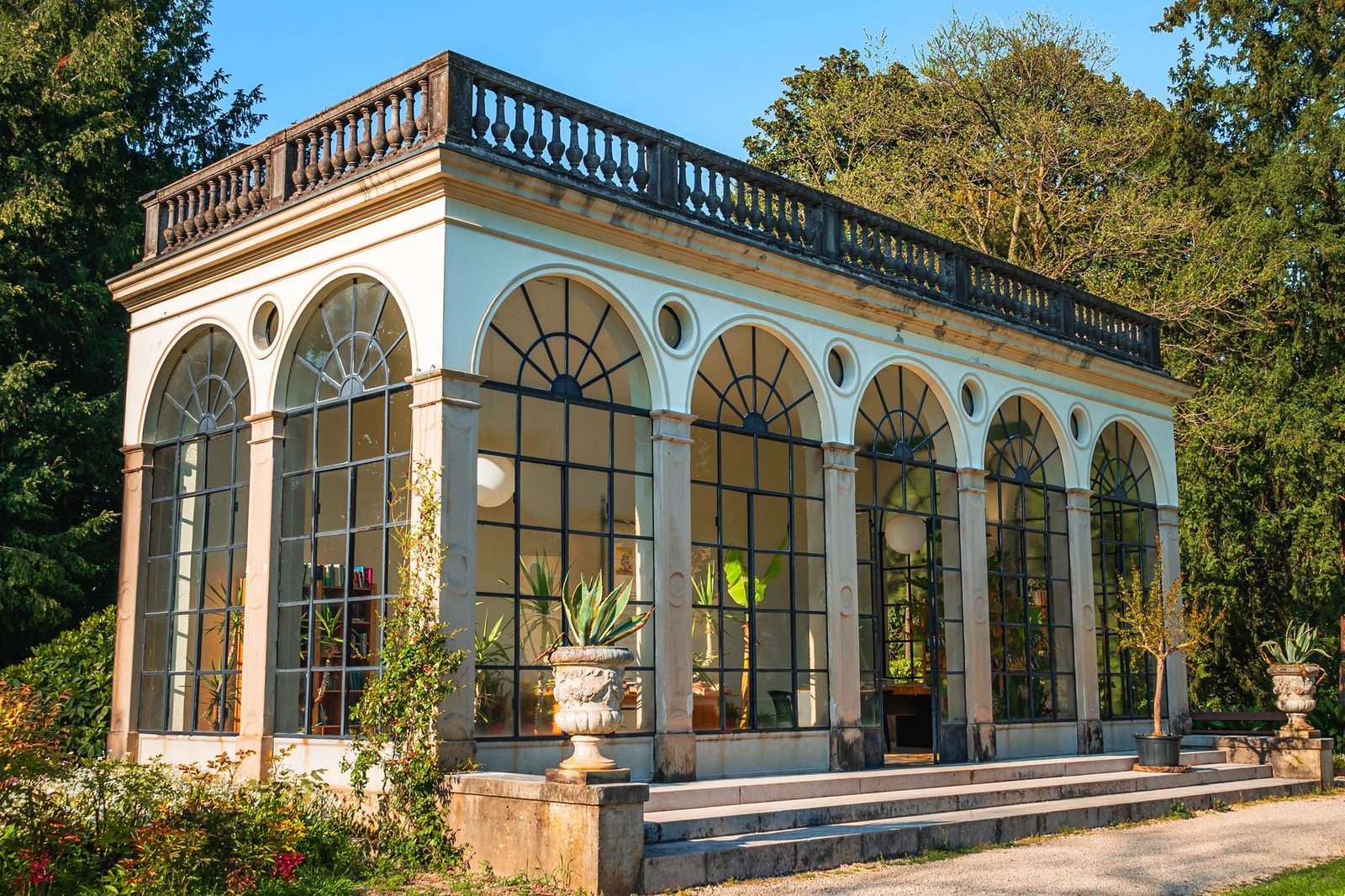 Classic orangery with tall arched windows and stone detailing